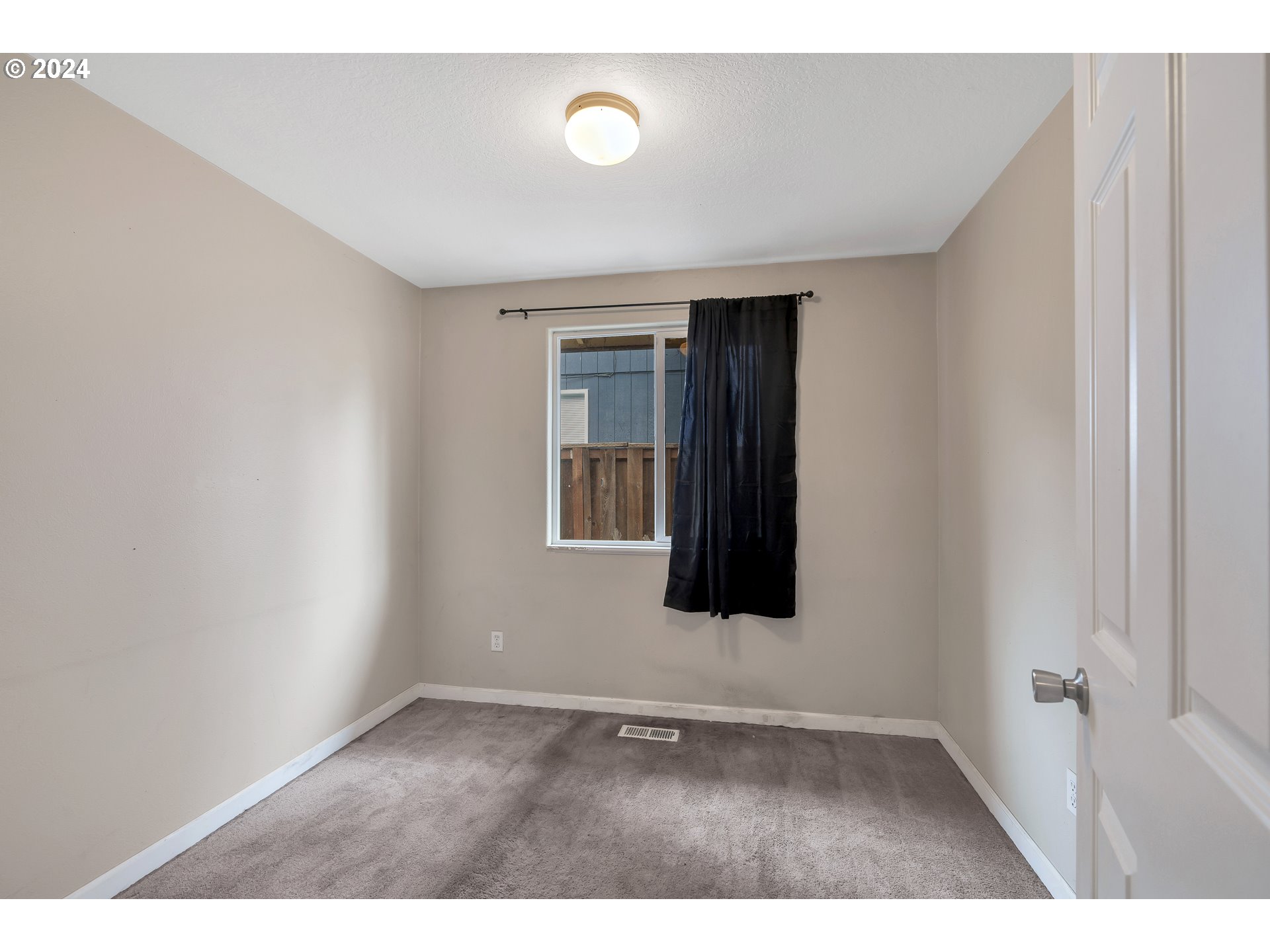 325 Cosmo Street Lafayette, OR 97127 - Photo 16 of 29 a view of an empty room with wooden floor and a window