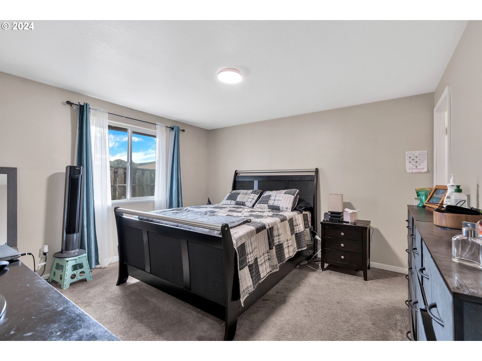 325 Cosmo Street Lafayette, OR 97127 - Photo 19 of 29 a bed sitting in a bedroom next to a window