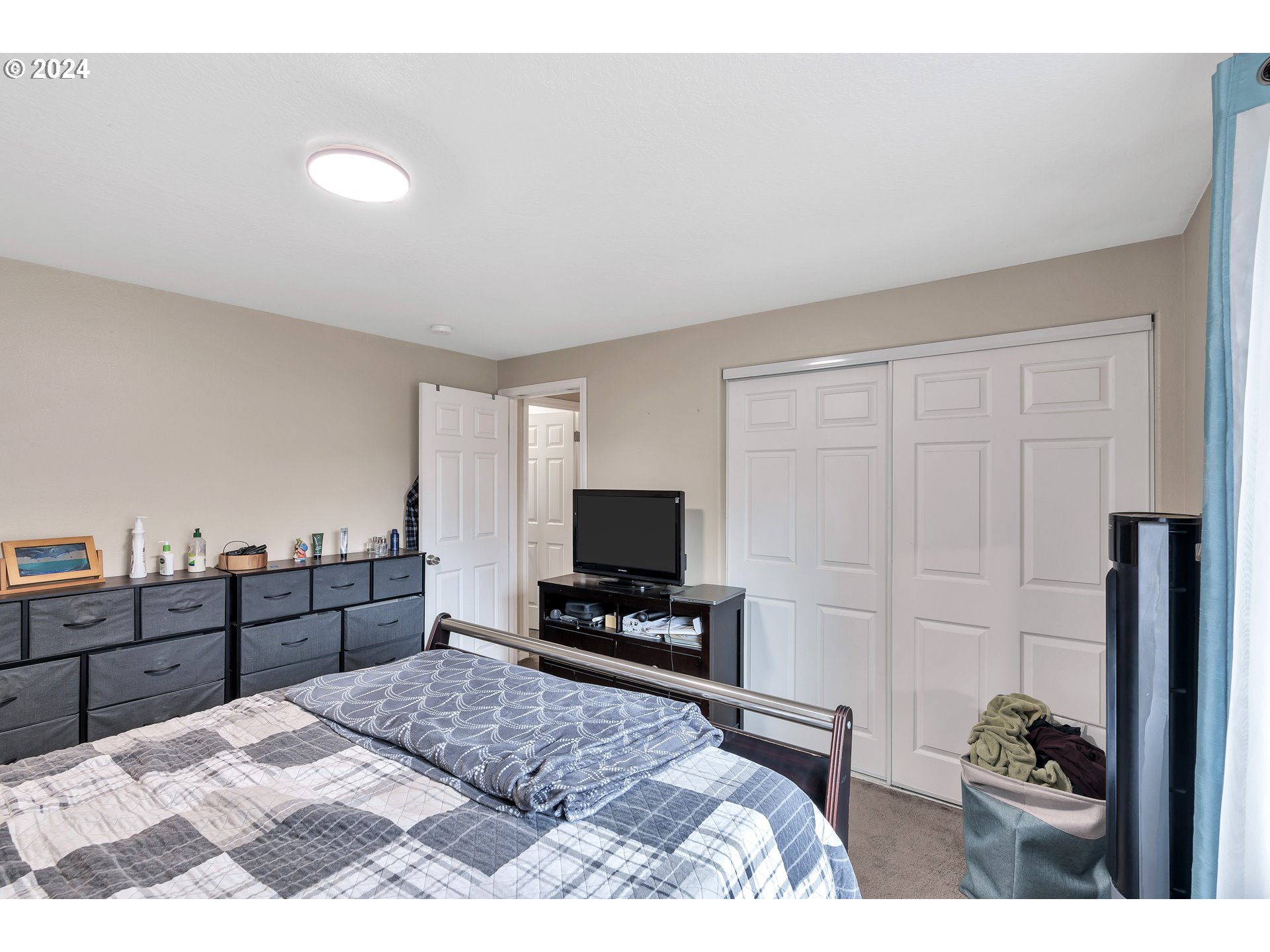 325 Cosmo Street Lafayette, OR 97127 - Photo 20 of 29 a bedroom with a bed and a dresser