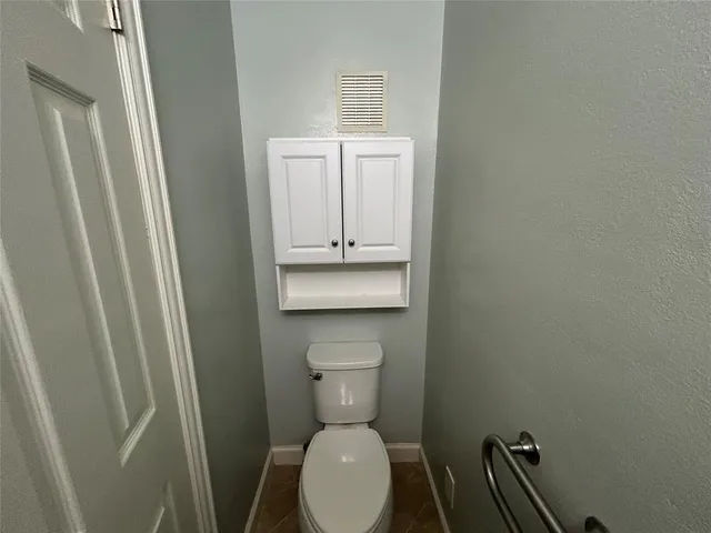 a bathroom with a toilet and a sink