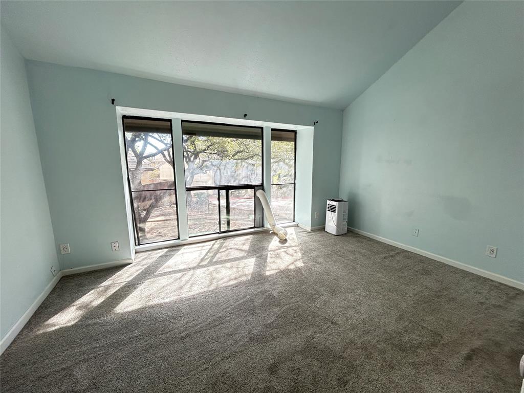 4535 North O'Connor Road, Unit 1216 Irving, TX 75062 - Photo 18 of 24 an empty room with large windows and mountain view