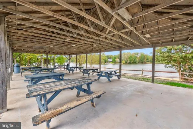 a view of swimming pool with outdoor seating