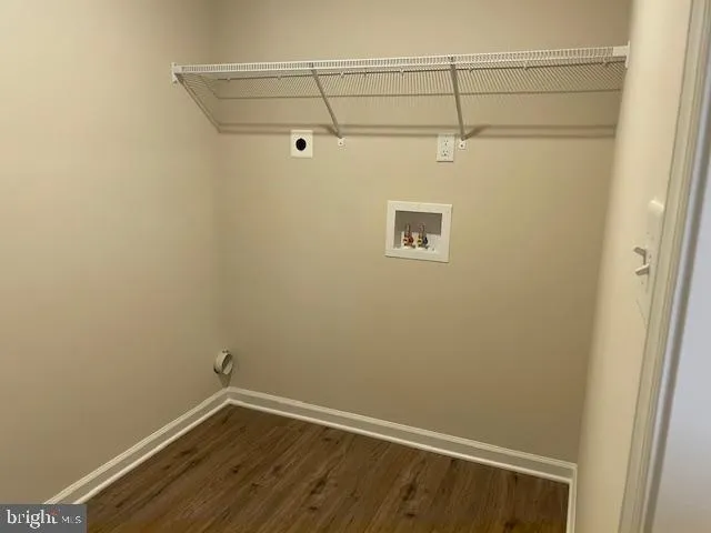 a view of a small space with wooden floor