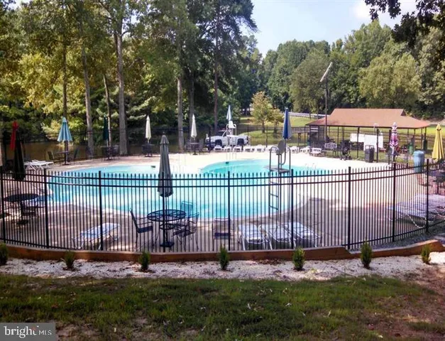 a view of a park with iron fence