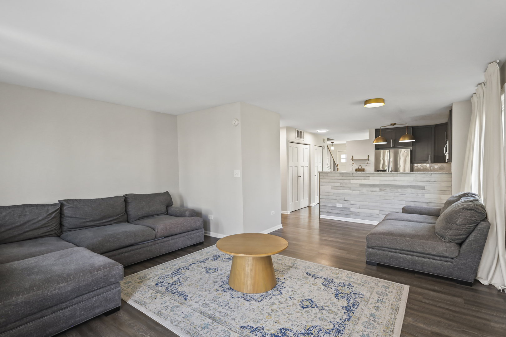2420 Roxbury Lane Montgomery, IL 60538 - Photo 11 of 25 a living room with furniture and a couch