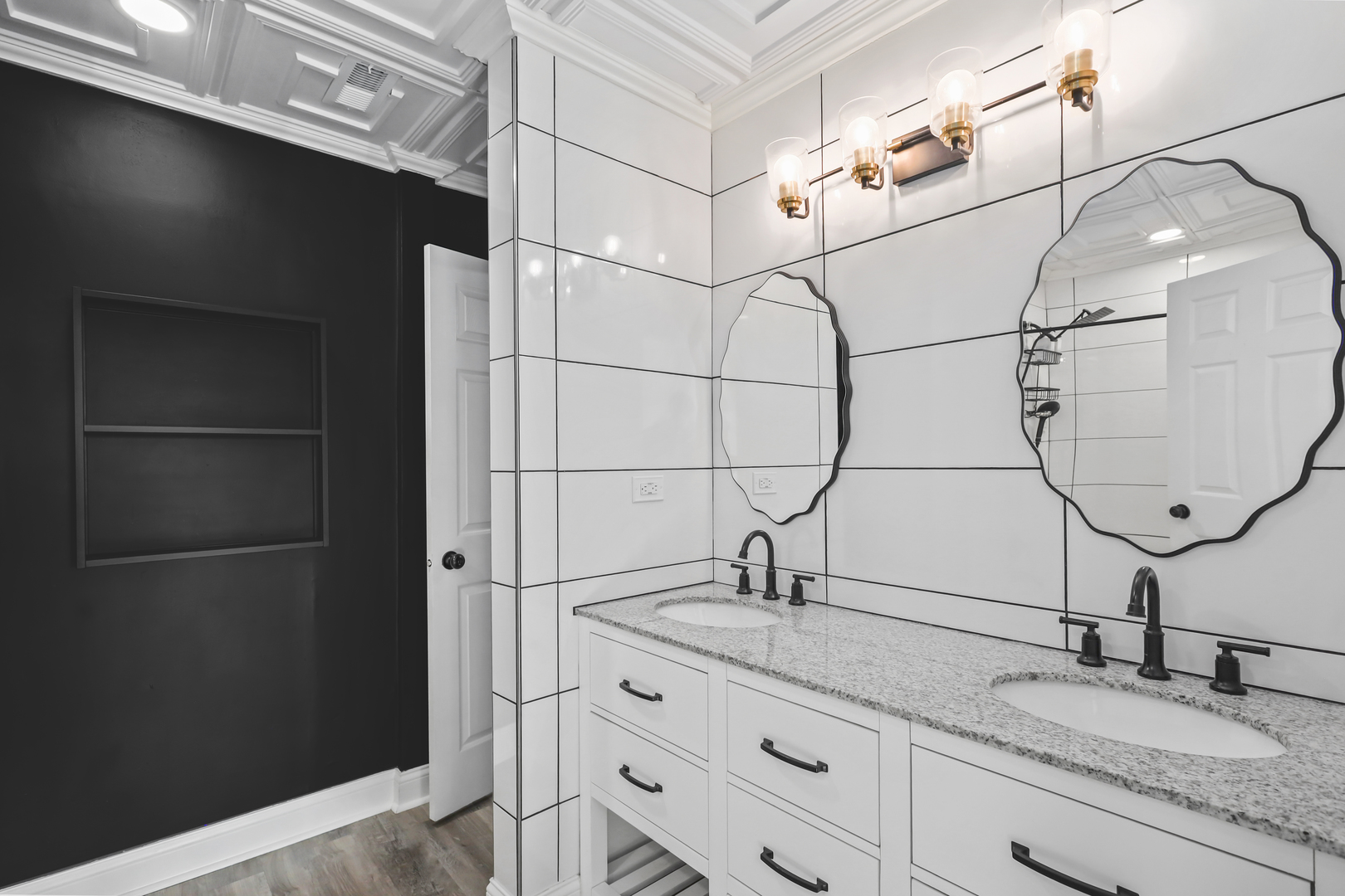 2420 Roxbury Lane Montgomery, IL 60538 - Photo 14 of 25 a bathroom with a granite countertop sink a mirror and shower