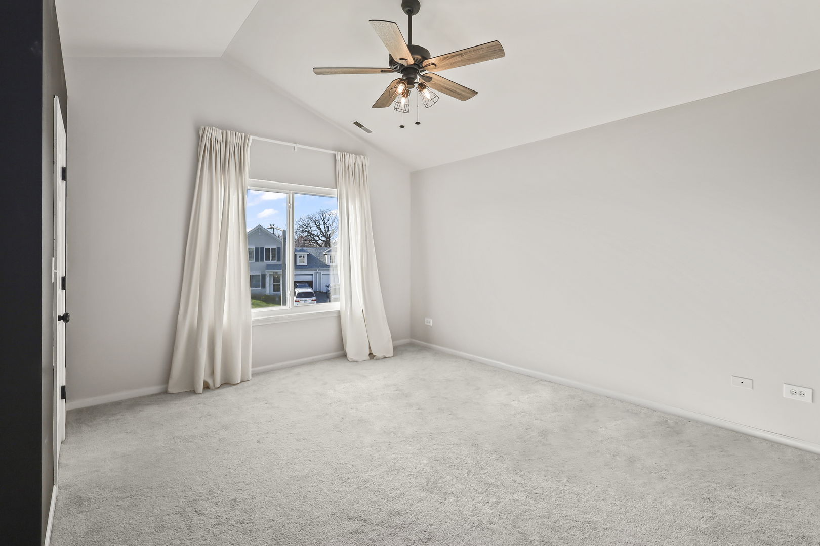 2420 Roxbury Lane Montgomery, IL 60538 - Photo 17 of 25 an empty room with windows and fan