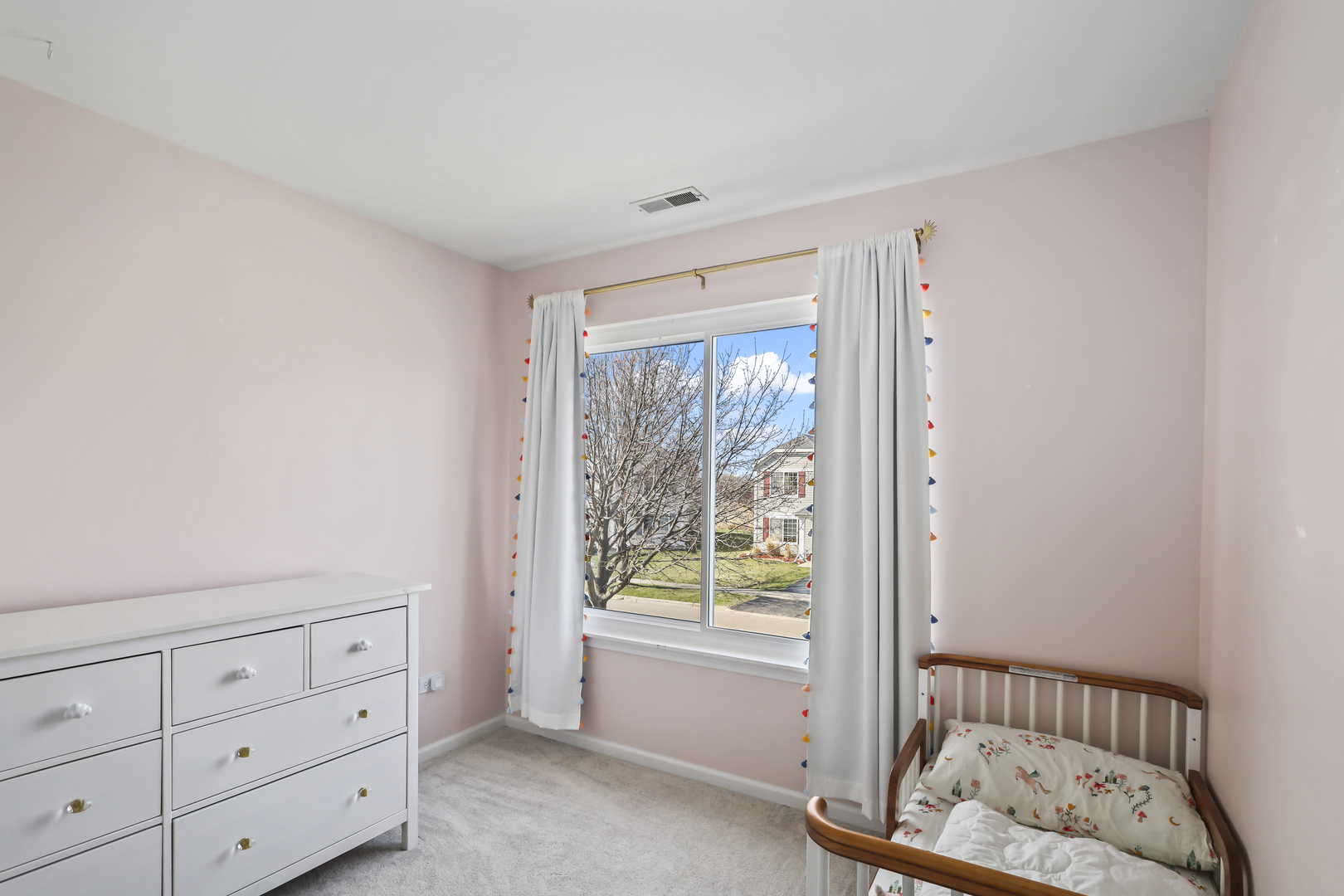 2420 Roxbury Lane Montgomery, IL 60538 - Photo 18 of 25 a view of room with window and dresser