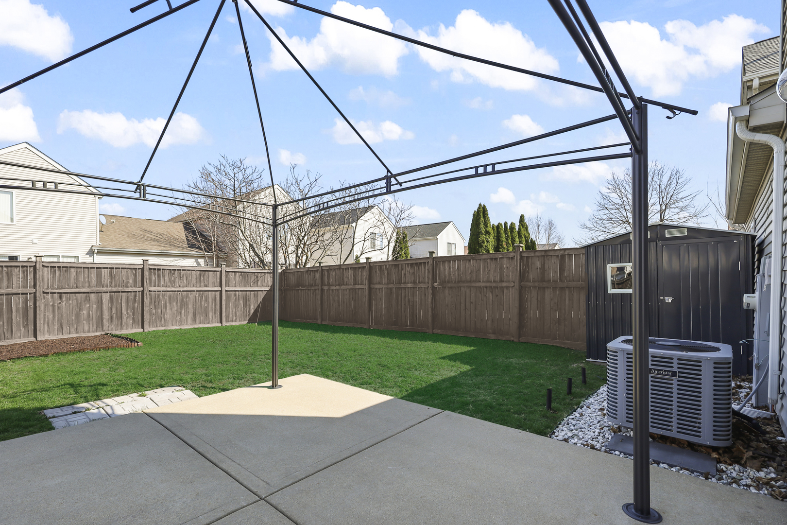 2420 Roxbury Lane Montgomery, IL 60538 - Photo 22 of 25 a view of a backyard with wooden fence