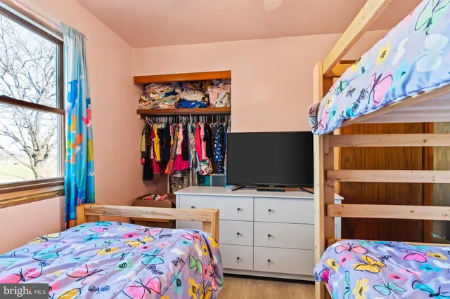 a bed room with a bed and a window