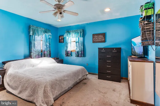 a bed room with a bed and a dresser