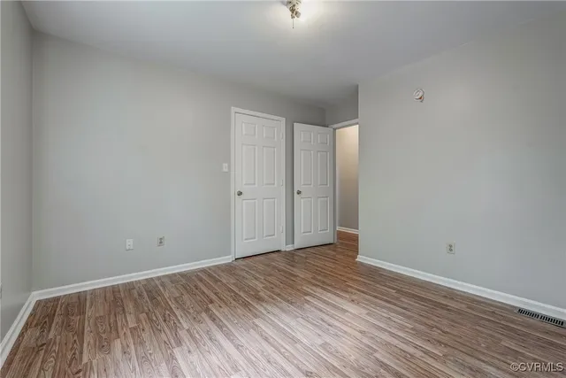 a view of room with wooden floor
