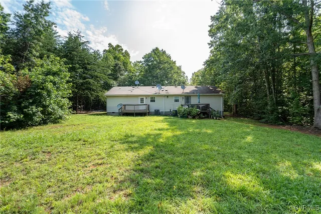 a aerial view of a house with yard and sitting area