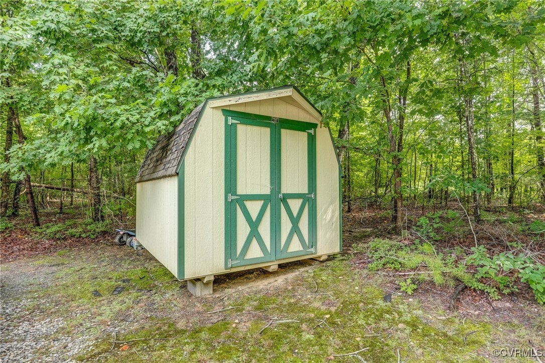 4385 Chappell Road Keysville, VA 23947 - Photo 28 of 29 a view of a house with a small yard and large tree