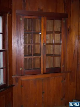 a view of a kitchen with a sink and a window