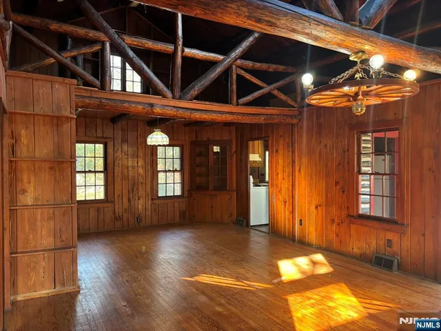 a view of a house with wooden floor and a window