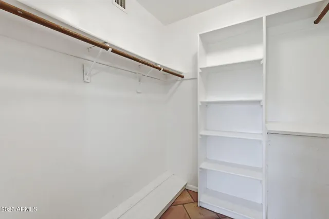 a bathroom with a sink double vanity and a shower