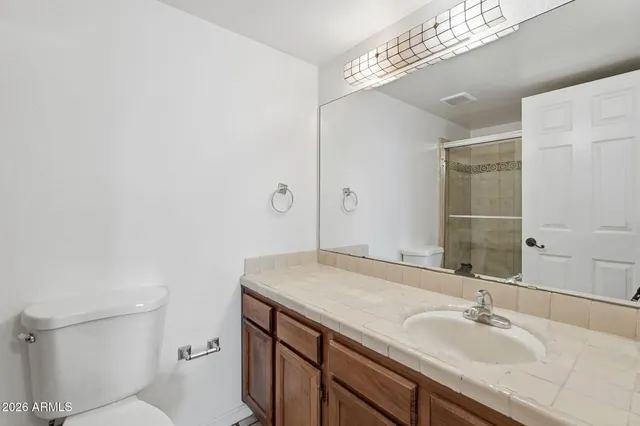 a bathroom with a shower and a bath tub