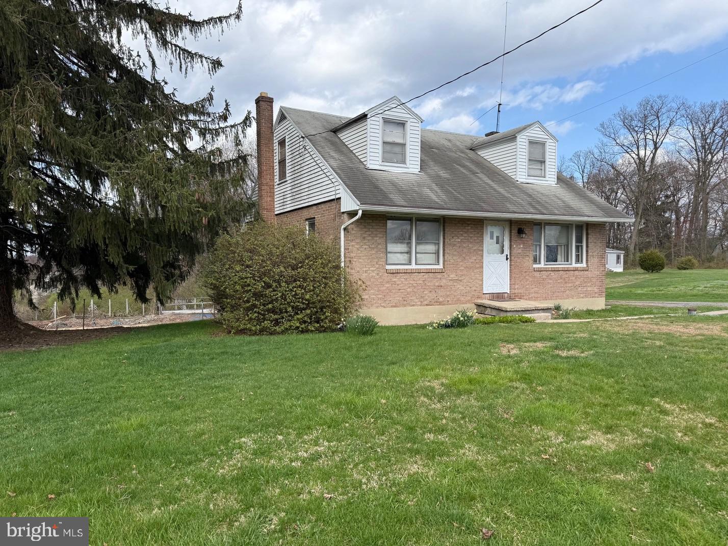 525 Mohns Hill Road Reading, PA 19608 - Photo 1 of 1 a front view of a house with a garden