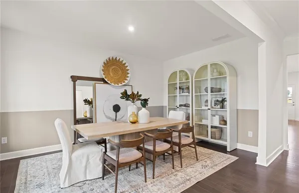 a view of a dining room with furniture and wooden floor