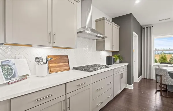a kitchen with cabinets and window