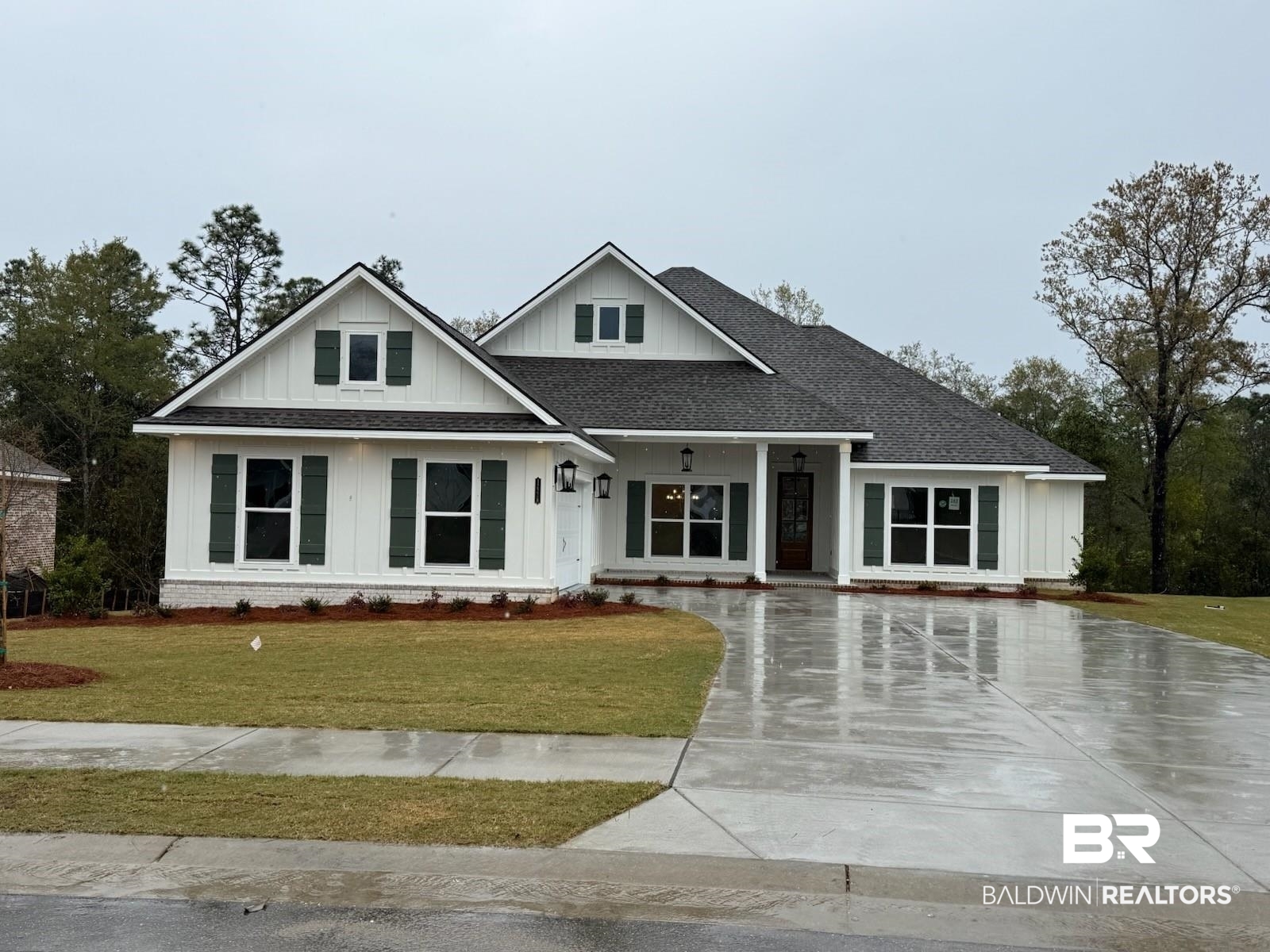 12218 Exbury Way Daphne, AL 36527 - Photo 1 of 38 Modern inspired farmhouse with driveway, a front yard, board and batten siding, and roof with shingles