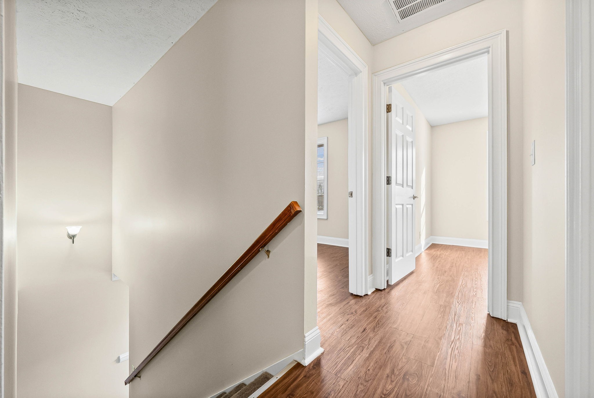 135 Excell Road, Unit 102 Clarksville, TN 37043 - Photo 13 of 24 a view of a hallway with wooden floor and staircase