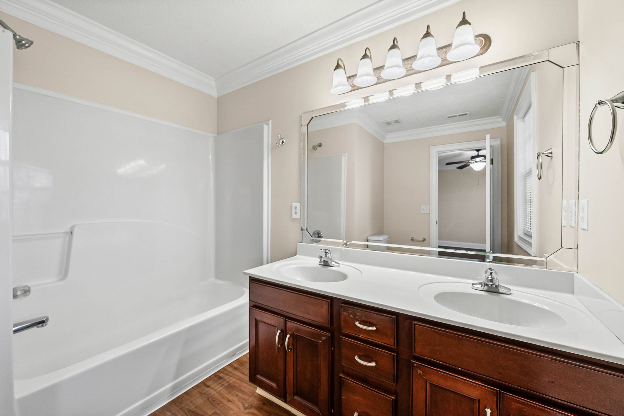 135 Excell Road, Unit 102 Clarksville, TN 37043 - Photo 16 of 24 a bathroom with a tub double sink double vanity and mirror