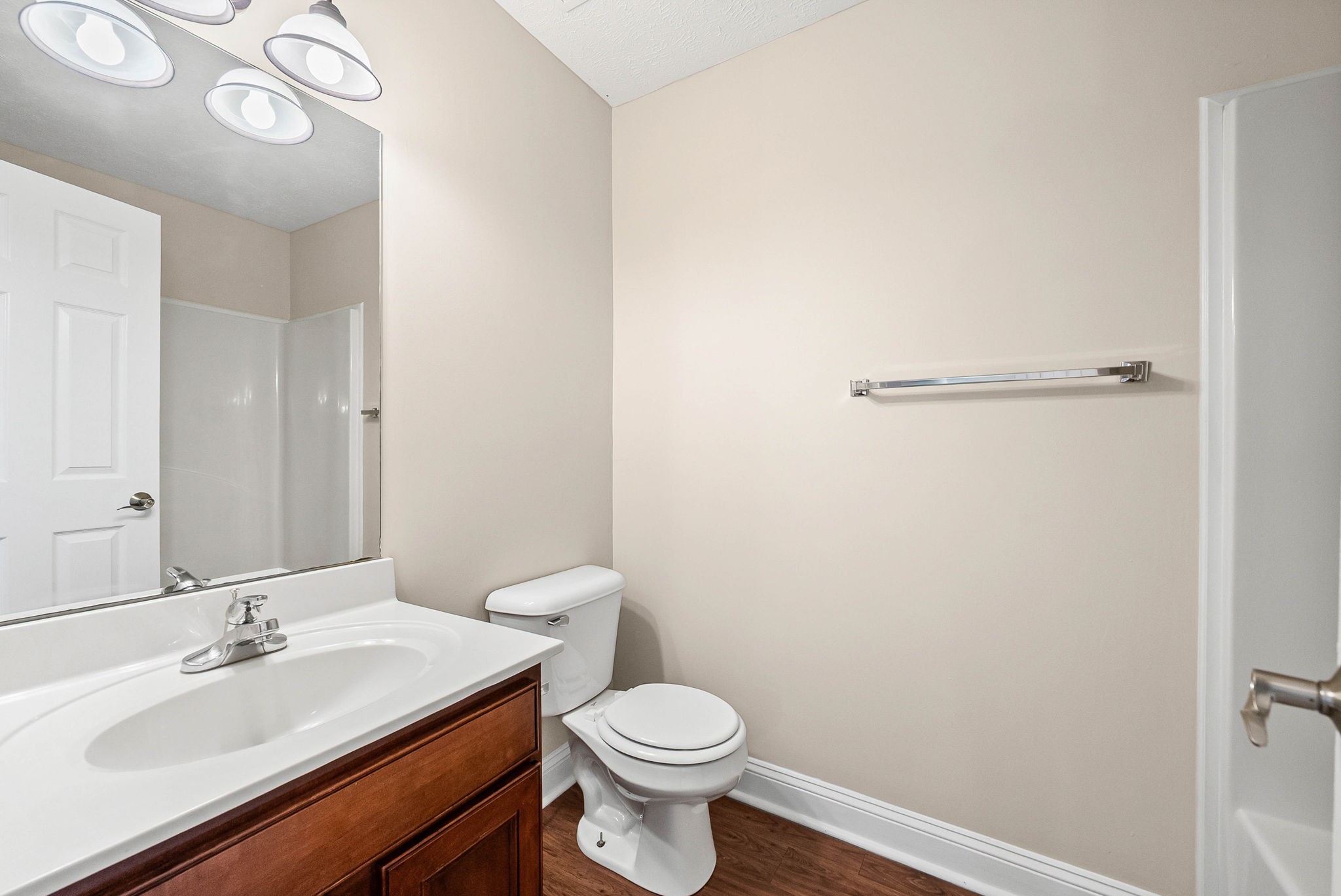 135 Excell Road, Unit 102 Clarksville, TN 37043 - Photo 19 of 24 a bathroom with a sink a toilet and mirror