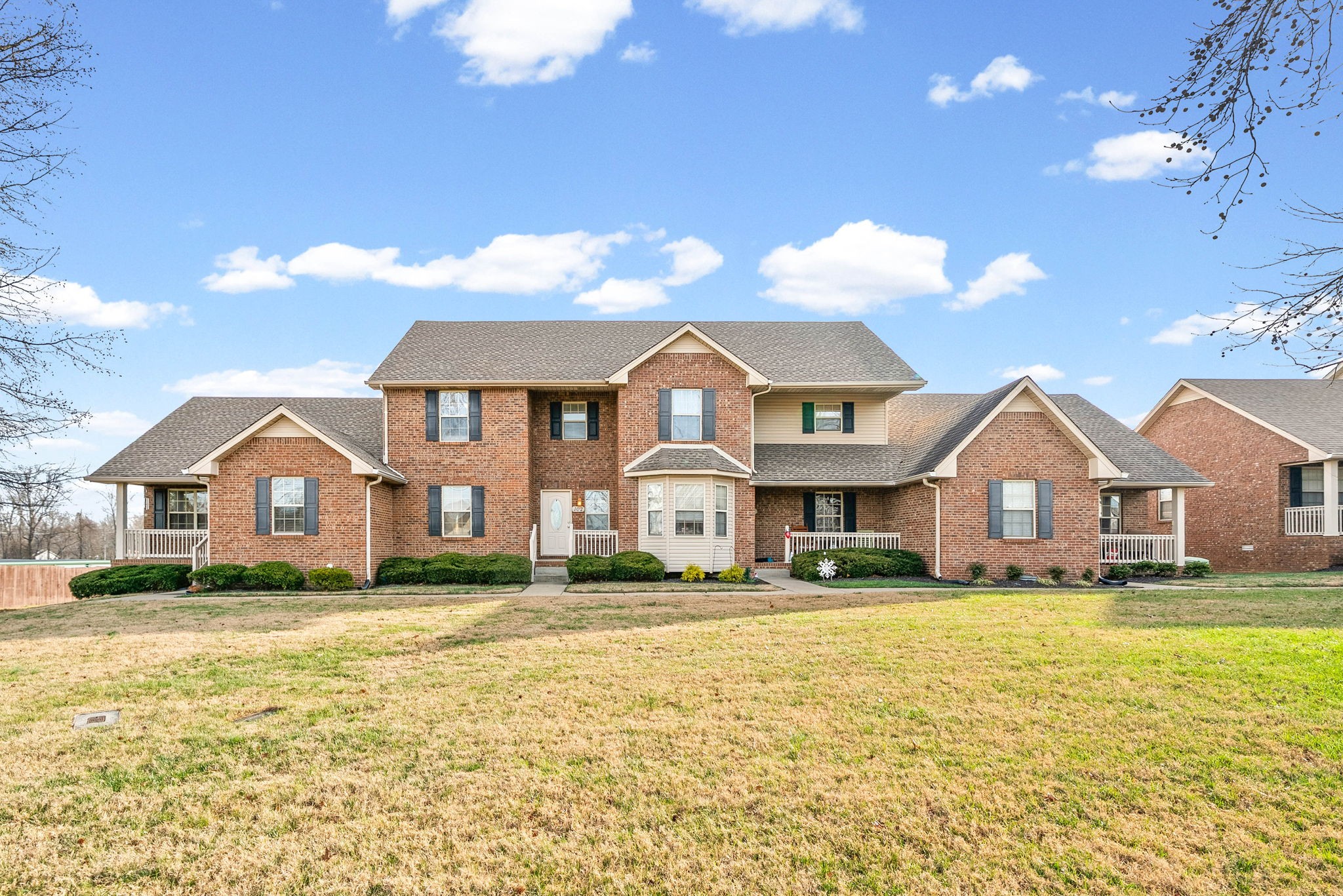 135 Excell Road, Unit 102 Clarksville, TN 37043 - Photo 24 of 24 a front view of a house with a yard