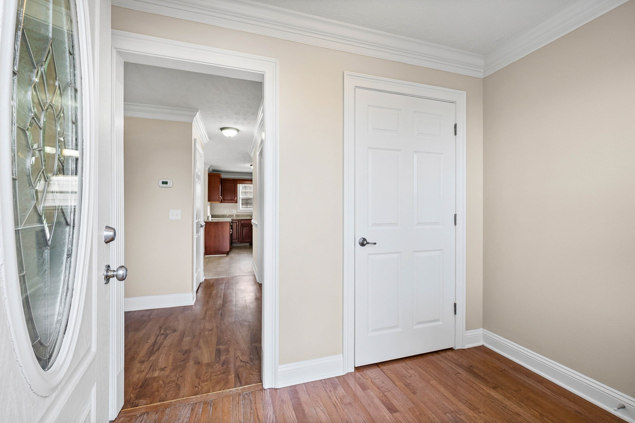 135 Excell Road, Unit 102 Clarksville, TN 37043 - Photo 3 of 24 a view of a hallway with wooden floor and a bathroom
