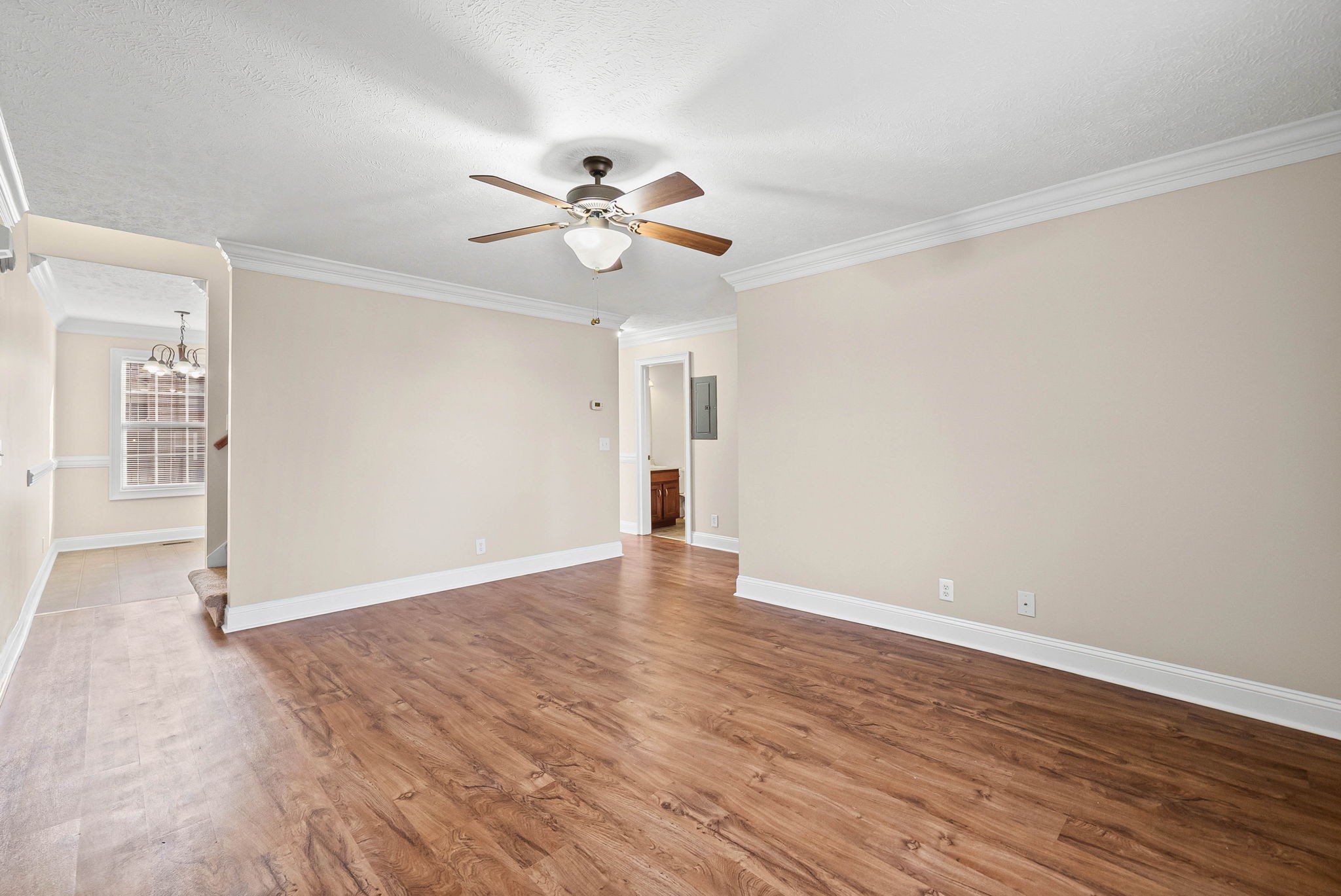 135 Excell Road, Unit 102 Clarksville, TN 37043 - Photo 5 of 24 a view of empty room with wooden floor and ceiling fan