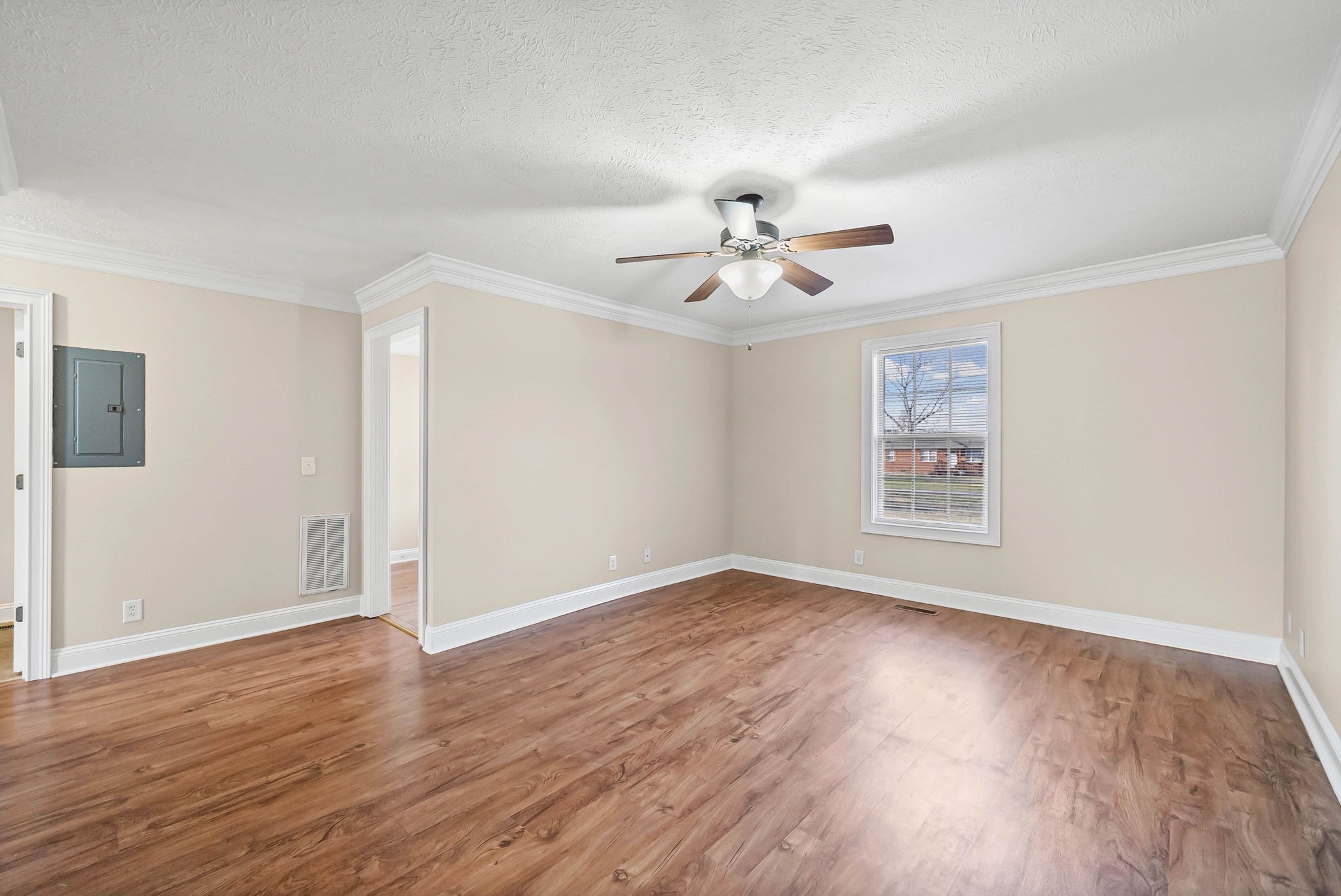 135 Excell Road, Unit 102 Clarksville, TN 37043 - Photo 6 of 24 a view of an empty room with a window and wooden floor