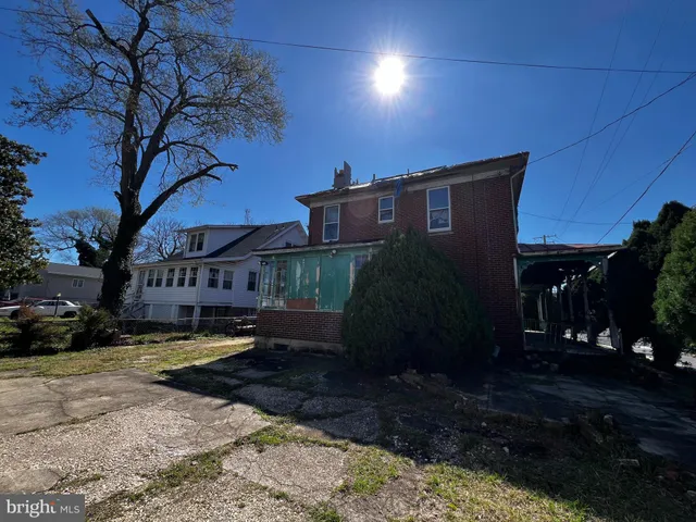 a view of a building with a yard