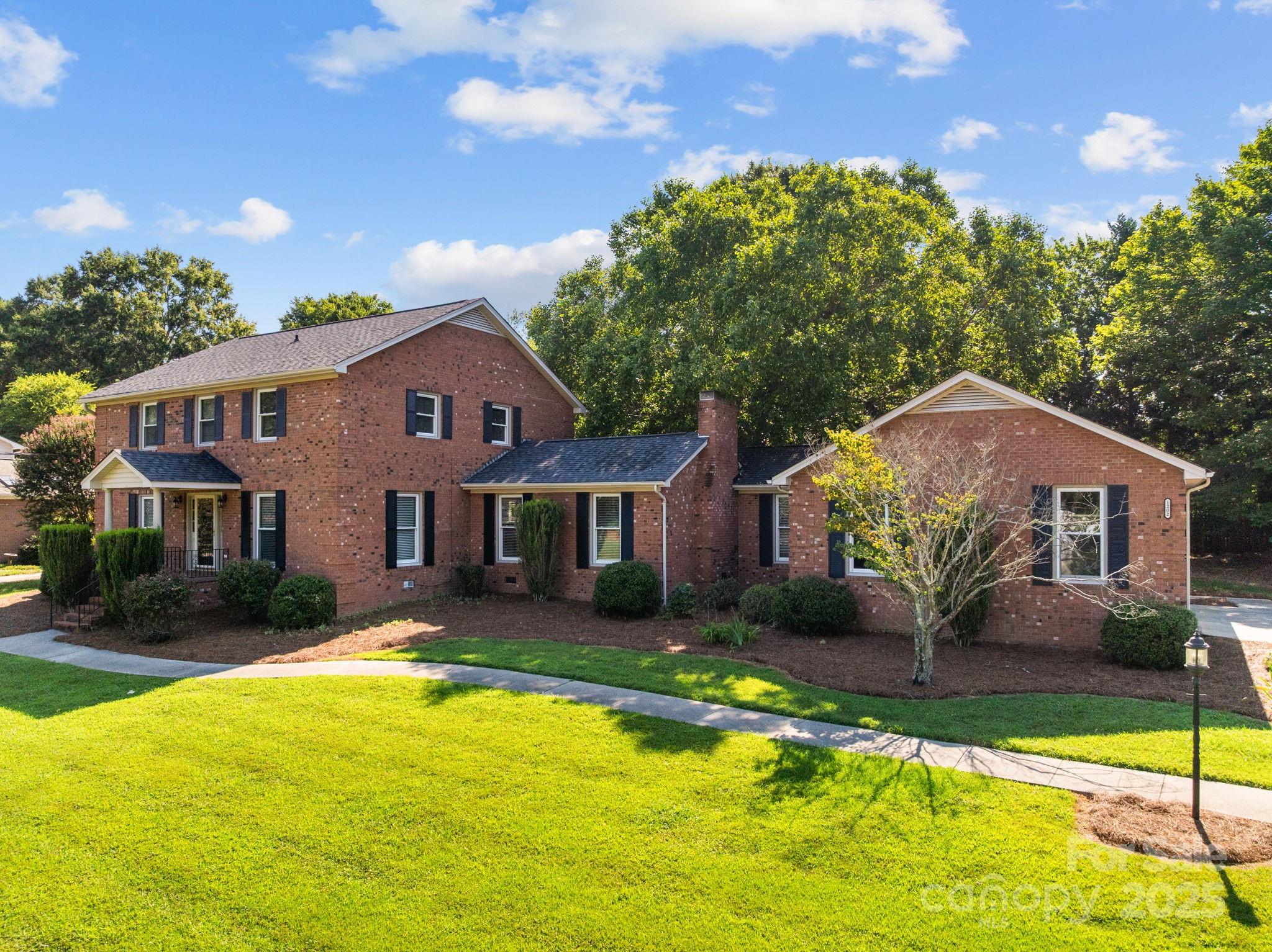 1202 Pineview Drive Albemarle, NC 28001 - Photo 2 of 41 a front view of a house with yard and green space