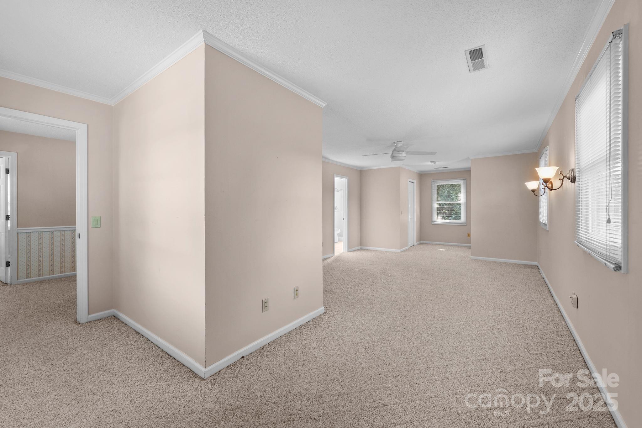 1202 Pineview Drive Albemarle, NC 28001 - Photo 36 of 41 a view of a big room with windows and chandelier