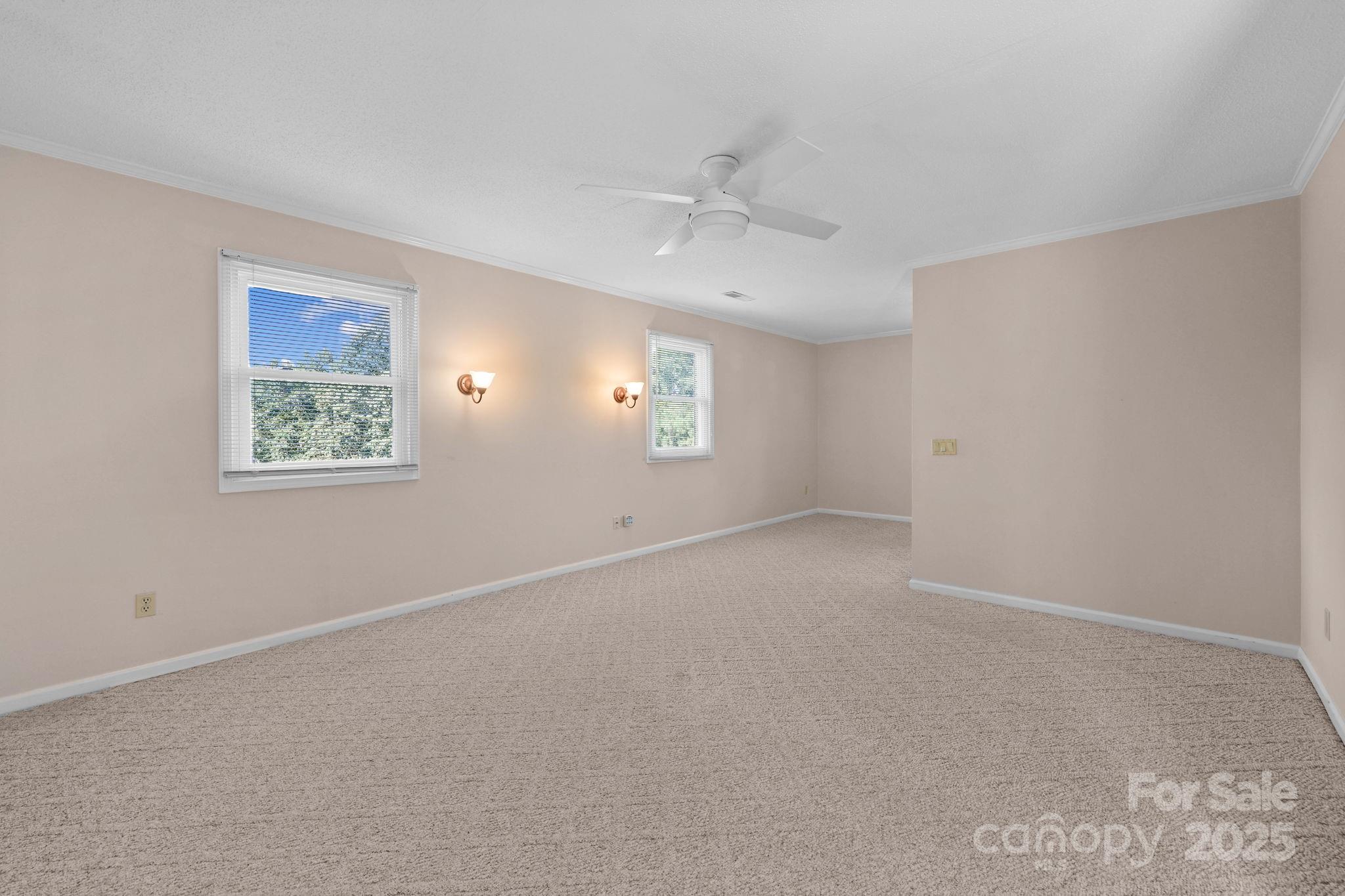 1202 Pineview Drive Albemarle, NC 28001 - Photo 39 of 41 an empty room with a window and ceiling fan
