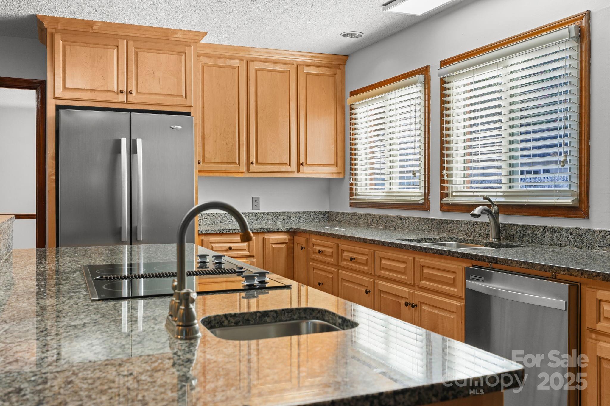 1202 Pineview Drive Albemarle, NC 28001 - Photo 7 of 41 a kitchen with granite countertop a sink and cabinets