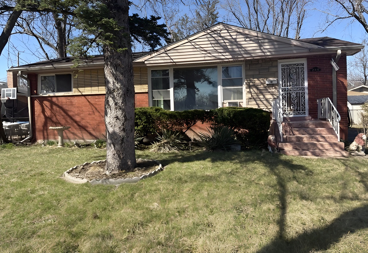 249 Eddy Street Chicago Heights, IL 60411 - Photo 1 of 10 a front view of a house with garden