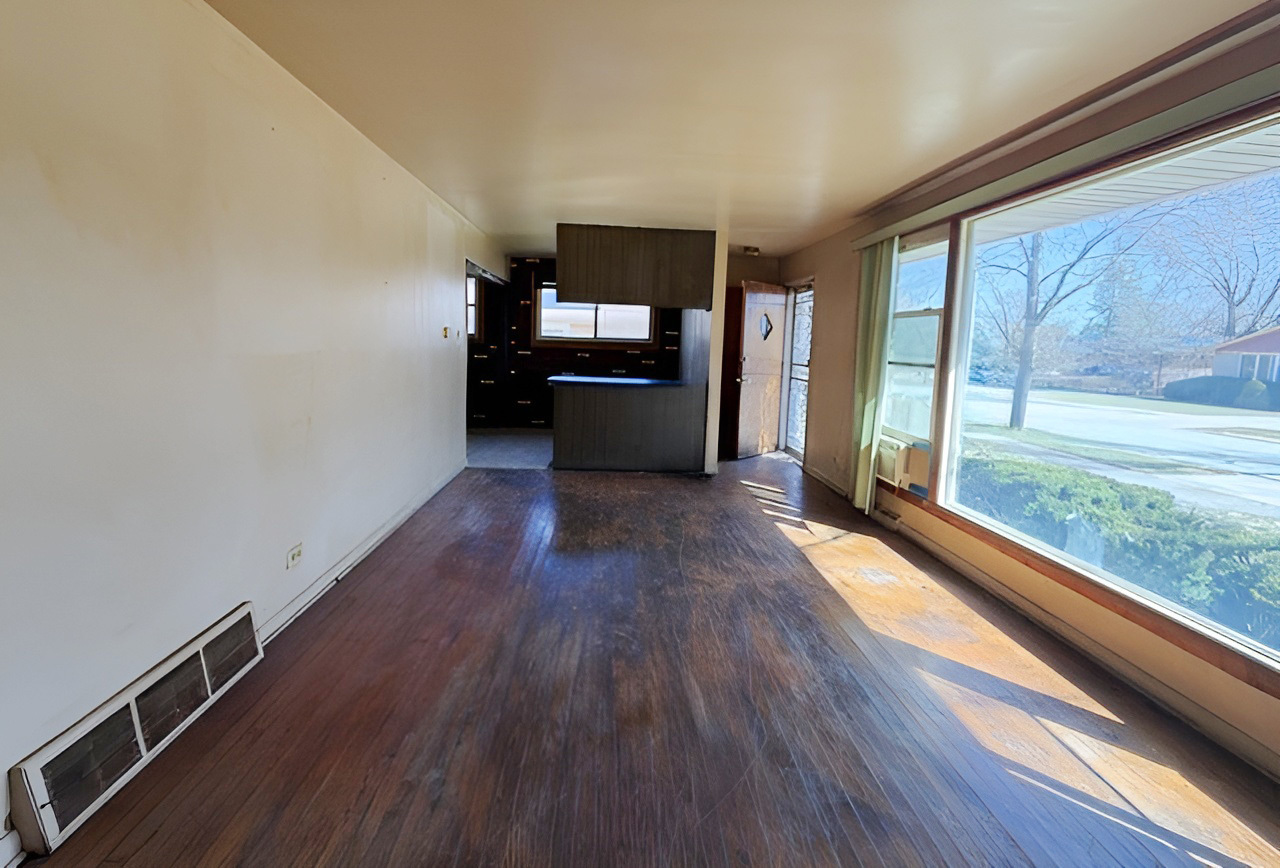 249 Eddy Street Chicago Heights, IL 60411 - Photo 3 of 10 a view of a room with wooden floor and a window
