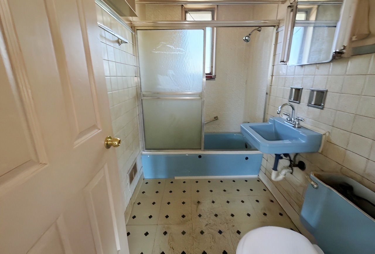249 Eddy Street Chicago Heights, IL 60411 - Photo 8 of 10 a bathroom with a sink toilet and shower