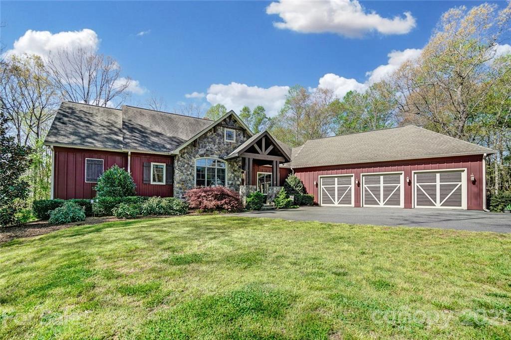 215 Eagle Cove Drive Cherryville, NC 28021 - Photo 2 of 48 a front view of a house with a yard and garage