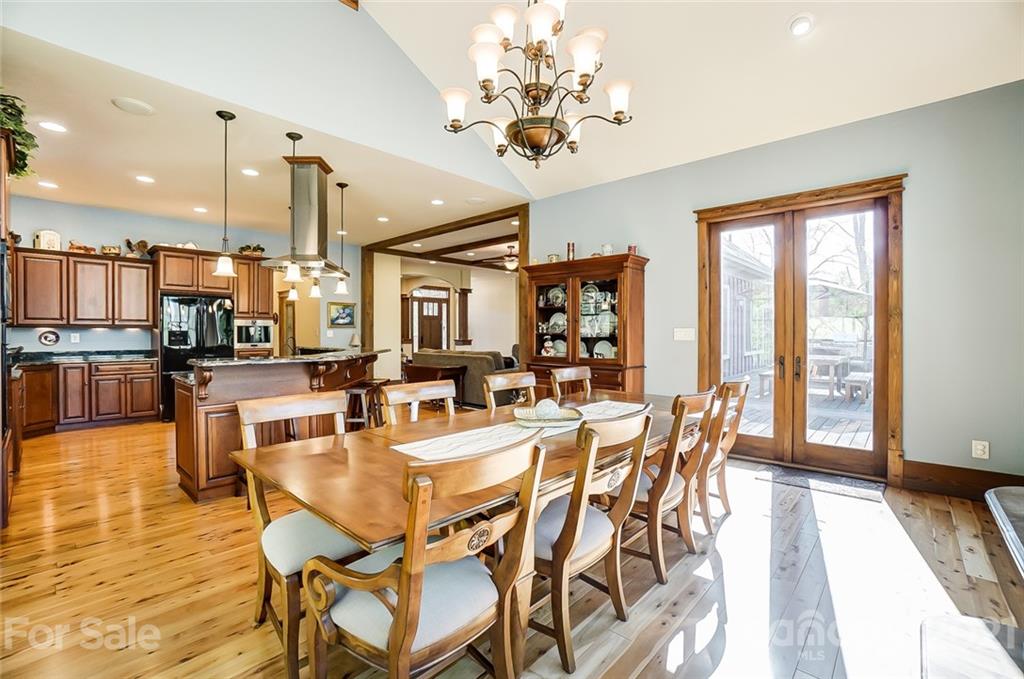 215 Eagle Cove Drive Cherryville, NC 28021 - Photo 15 of 48 a dining room with furniture a chandelier and wooden floor