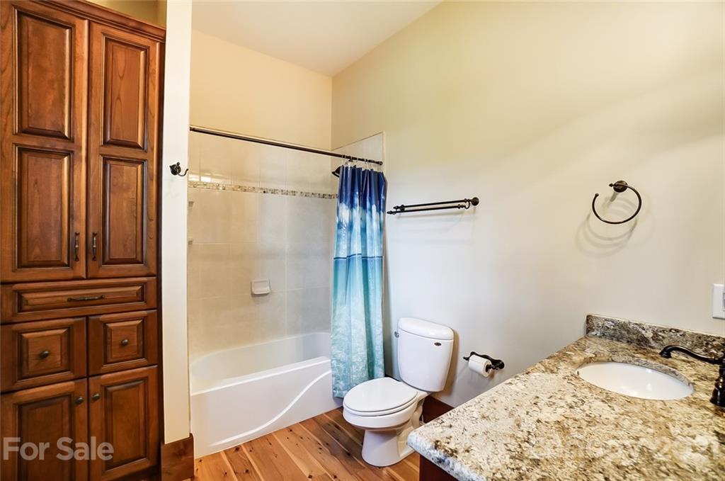 215 Eagle Cove Drive Cherryville, NC 28021 - Photo 23 of 48 a bathroom with a sink toilet and shower