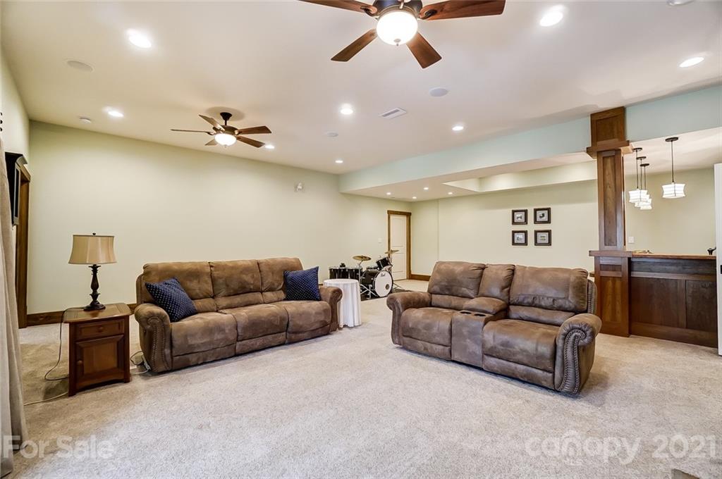 215 Eagle Cove Drive Cherryville, NC 28021 - Photo 27 of 48 a living room with furniture and a ceiling fan