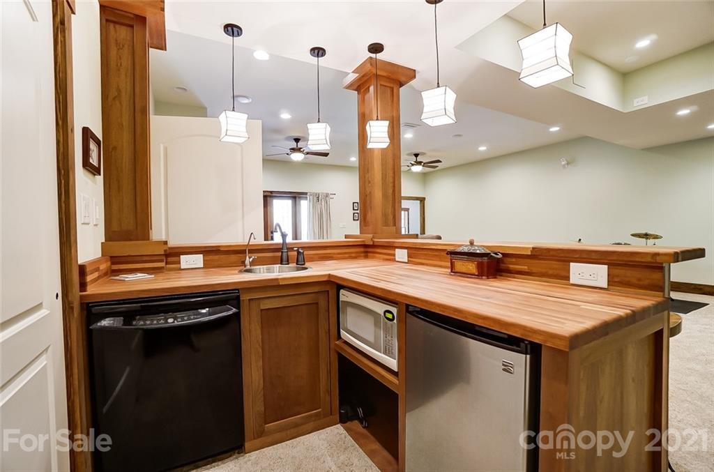215 Eagle Cove Drive Cherryville, NC 28021 - Photo 30 of 48 a kitchen with a sink a counter space appliances and cabinets