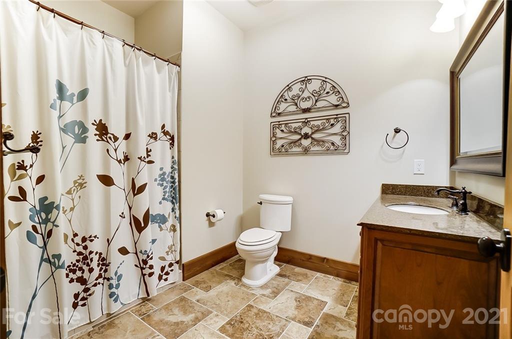 215 Eagle Cove Drive Cherryville, NC 28021 - Photo 34 of 48 a bathroom with a sink toilet and a shower