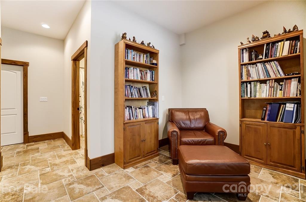 215 Eagle Cove Drive Cherryville, NC 28021 - Photo 36 of 48 a living room with furniture and a book shelf