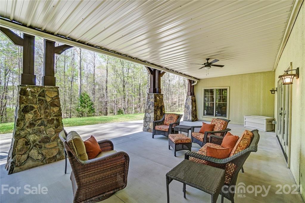 215 Eagle Cove Drive Cherryville, NC 28021 - Photo 40 of 48 a living room with furniture and a floor to ceiling window