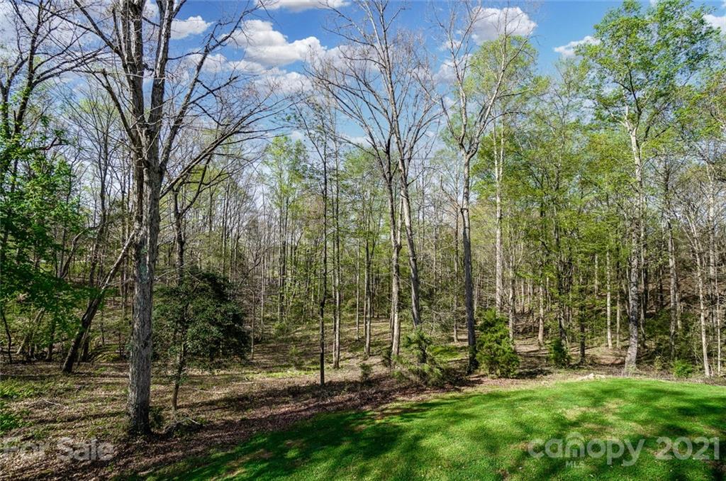 215 Eagle Cove Drive Cherryville, NC 28021 - Photo 44 of 48 a view of a backyard with a barn